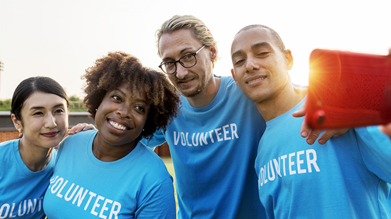 Diverse volunteers taking a selfie together