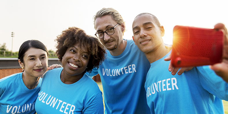 Diverse volunteers taking a selfie together